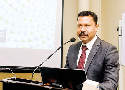 Dr. Hansaka Wijemuni speaking at the event